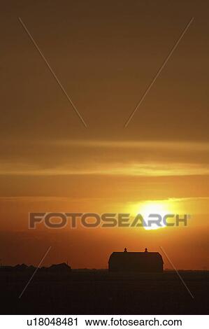 Stock Image - behind, sun, clouds, up, lighting, setting. Fotosearch