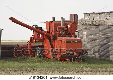 Stock Image - building, case, farm, next, combine, old. Fotosearch