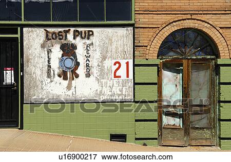 Stock Photo - building, puppy, abandoned, side, sign, lost. Fotosearch