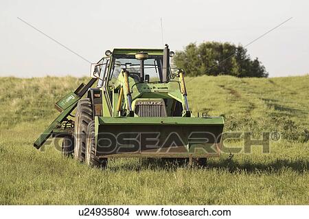 Picture - canada, left, saskatchewan, scenic, field, tractor. Fotosearch