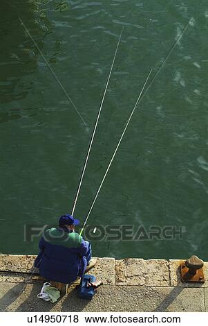 Stock Photo - carles, spain, sant, tarragona, catalunya, fisherman. Fotosearch