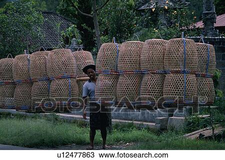 Stock Image - carrying, indonesia, bali, baskets, male. Fotosearch