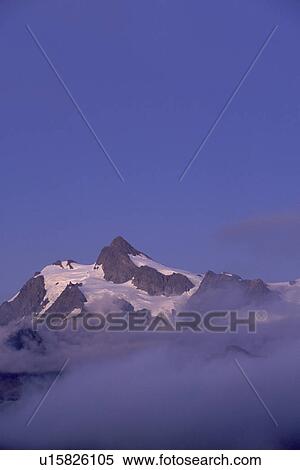 Stock Photography - cascades, scenic, glacier, dusk, blue, alpine. Fotosearch