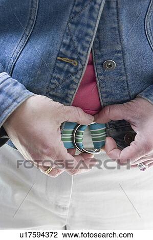 Stock Image - colorful, female, adjusting, 38, age, woman. Fotosearch