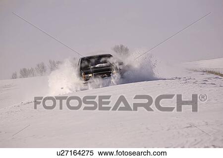 Stock Photography - covered, breaking, snow, through, trail, truck. Fotosearch