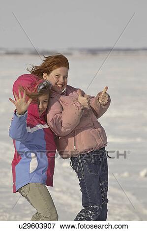 covered, young, snow, posing, girls, two View Large Photo Image Stock Photo - covered, young, snow, posing, girls, two. Fotosearch