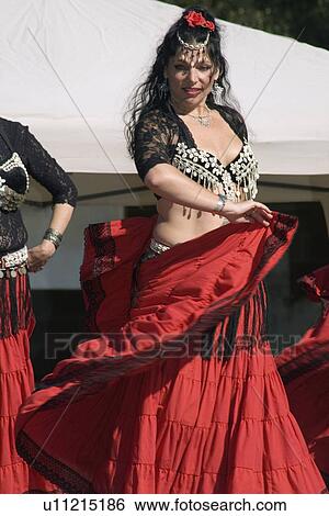 Stock Photograph - dance, dancer, skirt, red, swirling, belly. Fotosearch