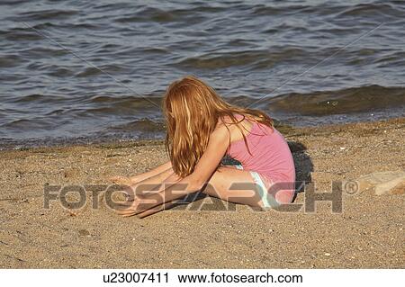 diefenbaker, girl, lake, beach, enjoying, young View Large Photo Image Stock Image - diefenbaker, girl, lake, beach, enjoying, young. Fotosearch