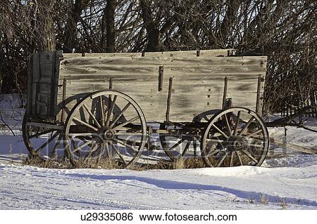 Stock Photograph - driveway, wagon, covered, snow, next, wooden. Fotosearch