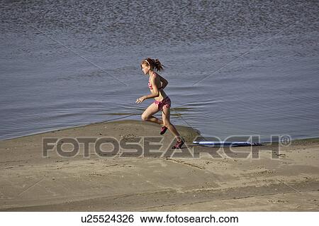 end, girl, southeast, beach, running, young View Large Photo Image Stock Photograph - end, girl, southeast, beach, running, young. Fotosearch