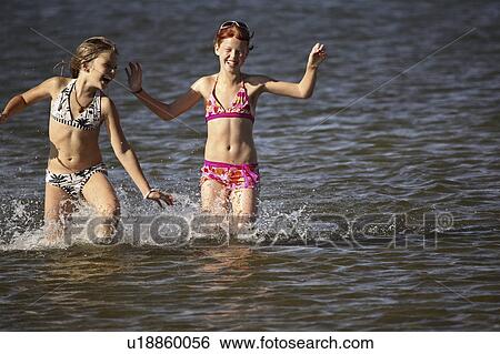 end, girls, southeast, water, playing, two View Large Photo Image Stock Photograph - end, girls, southeast, water, playing, two. Fotosearch