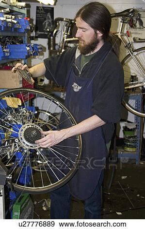 Stock Photo - express, making, youth, repair, bicycle, worker. Fotosearch