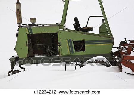 Stock Image - farm, white, green, machine, snowdrifts. Fotosearch
