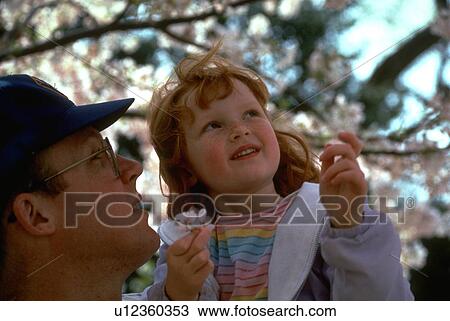 Stock Image - father, headed, red, male, young. Fotosearch