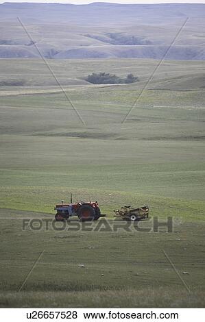 Stock Photo - field, rock, idle, left, picker, tractor. Fotosearch