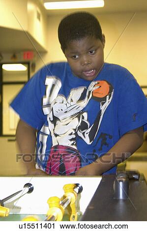 Stock Image - game, youth, playing, 10, age, black. Fotosearch