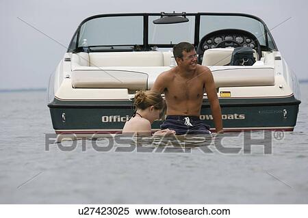 Stock Photography - girl, boat, water, boy. Fotosearch