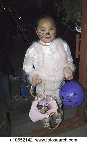 Stock Image - halloween, age, treaters, trick, asian. Fotosearch