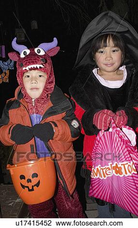 Stock Image - halloween, trick, costumed, dragons, treater, asian. Fotosearch