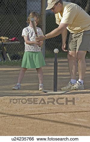 Stock Photograph - helping, batter, tball, girl, coach. Fotosearch