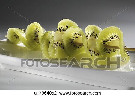 Stock Image - kiwi, fruit, background, white, skewer. Fotosearch