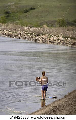 lake, young, pound, buffalo, girls, two View Large Photo Image Stock Image - lake, young, pound, buffalo, girls, two. Fotosearch