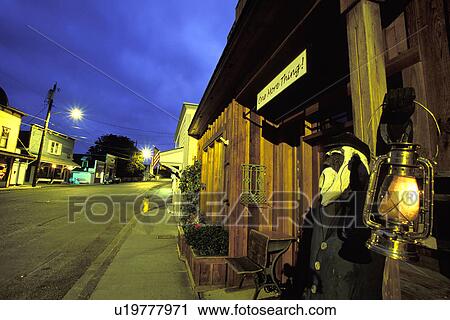 Stock Image - lantern, captain, lit, holding, statue, wood. Fotosearch