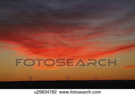 Stock Image - lighting, clouds, sun, morning, predawn, reddish. Fotosearch