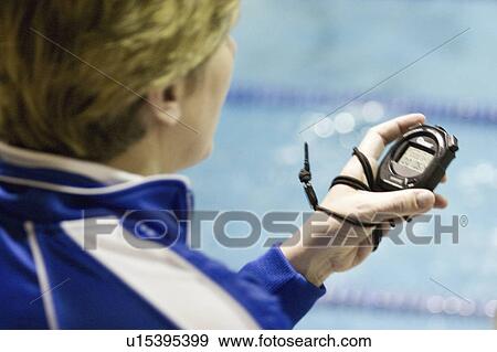 Stock Photo - macalester, timing, meet, swim, college, coach. Fotosearch