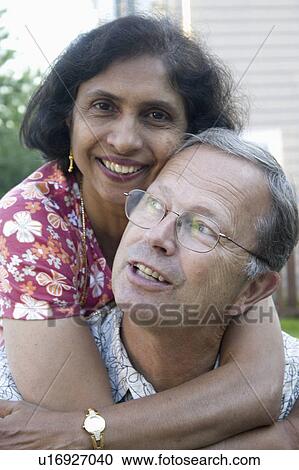 Stock Image - male, embrace, warm, enjoying, lucky. Fotosearch