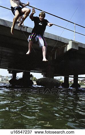 Stock Photo - male, energy, water, jumping, young. Fotosearch