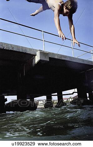 Stock Photo - male, energy, water, jumping, young. Fotosearch