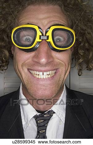 Stock Photography - male, smiling, freak, goggles, freaky. Fotosearch