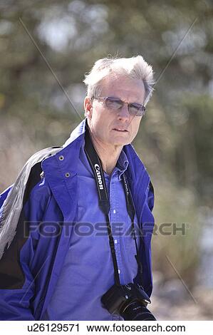 Stock Image - outdoors, florida, scenic, camera, male. Fotosearch