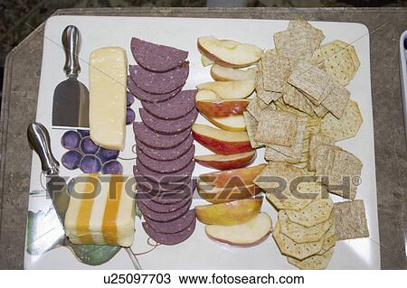 Stock Image - party, cheese, slices, apple, meat, crackers. Fotosearch