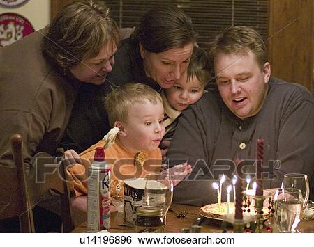 Stock Photograph - paul, blowing, candles, birthday, out, family. Fotosearch