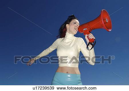 Stock Photo - phone, woman, mega, yelling, female, beautiful. Fotosearch