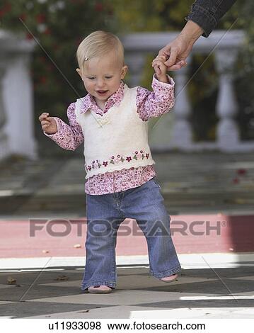 Stock Photo - posing, boy, hand, father, holding, young. Fotosearch