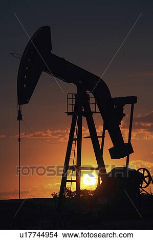 Picture - pump, setting, oil, mission, behind, sun. Fotosearch