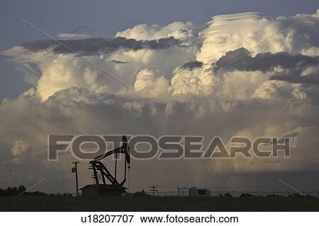 Stock Photo - pump, thunderhead, oil, building, clouds, cumulonimbus. Fotosearch