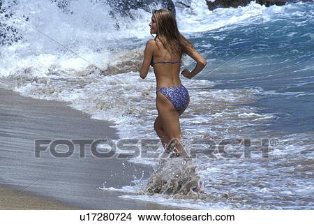 released, view, beach, running, model, back View Large Photo Image Picture - released, view, beach, running, model, back. Fotosearch