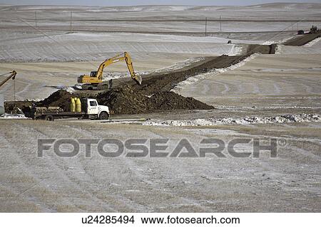 saskatchewan, hoe, ditch, pipeline, digging, track View Large Photo Image Picture - saskatchewan, hoe, ditch, pipeline, digging, track. Fotosearch