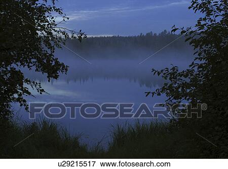 Stock Photo - saskatchewan, mist, sunrise, lake, trees, northern. Fotosearch