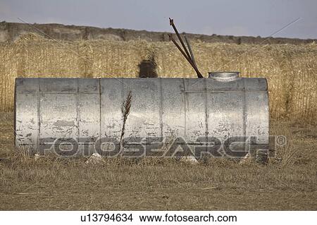 Picture - saskatchewan, tank, scenic, bales, straw, water. Fotosearch