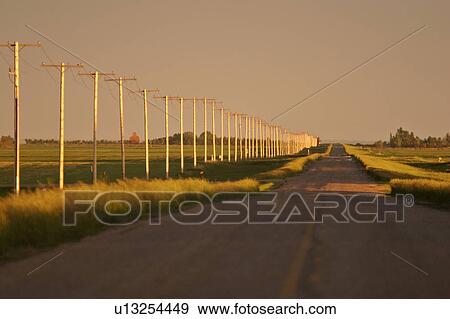 Stock Photo - saskatchewan, telephone, scenic, sunset, poles, line. Fotosearch