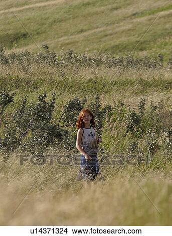 scenic, girl, grass, tall, standing, young View Large Photo Image Picture - scenic, girl, grass, tall, standing, young. Fotosearch