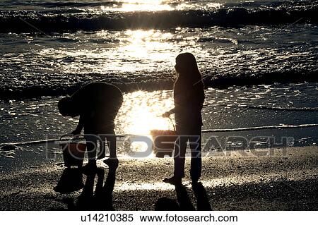 scenic, kids, sunset, beach, enjoying, children View Large Photo Image Stock Photography - scenic, kids, sunset, beach, enjoying, children. Fotosearch