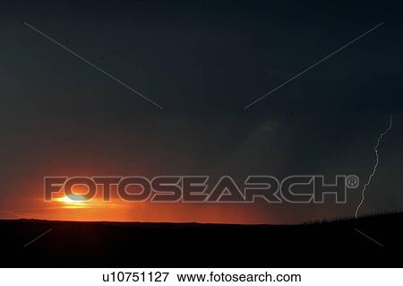 Stock Photo - scenic, setting, clouds, storm, through, sun. Fotosearch