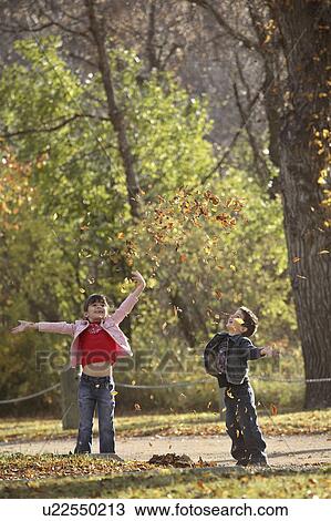 scenic, tossing, leaves, autumn, up, siblings View Large Photo Image Stock Image - scenic, tossing, leaves, autumn, up, siblings. Fotosearch