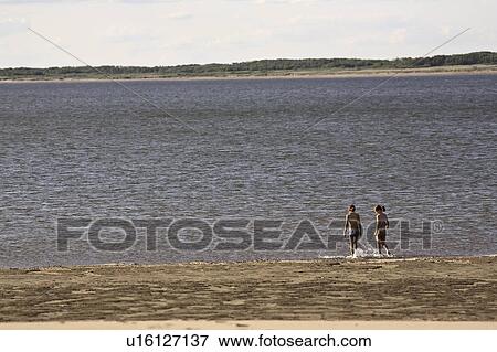 Stock Photo - scenic, young, lake, diefenbaker, girls, two. Fotosearch
